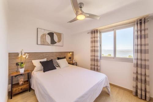 Ένα ή περισσότερα κρεβάτια σε δωμάτιο στο Apartamento LAKE & SEA