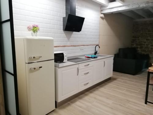 Η κουζίνα ή μικρή κουζίνα στο Apartamentos La Casa De Allá 1