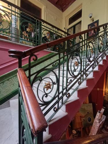 an iron railing on a staircase in a house at El Secreto Casa Art in Montevideo
