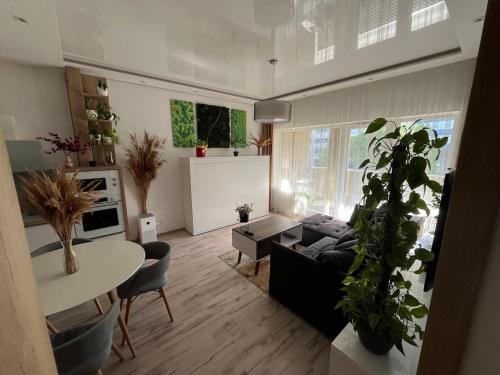 a living room with a couch and a table at Cozy apartment close to the city center in Bratislava