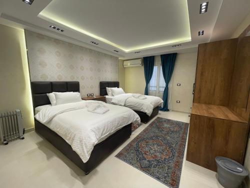 Un pat sau paturi într-o cameră la ArabElite