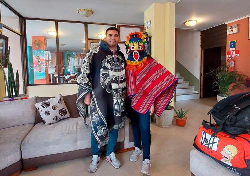 a man is dressed in a costume of a clown at La Merced Plaza Hospedaje in Riobamba