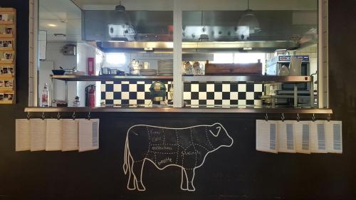 a cow painted on the wall of a restaurant at Droste's Herberg in Tubbergen