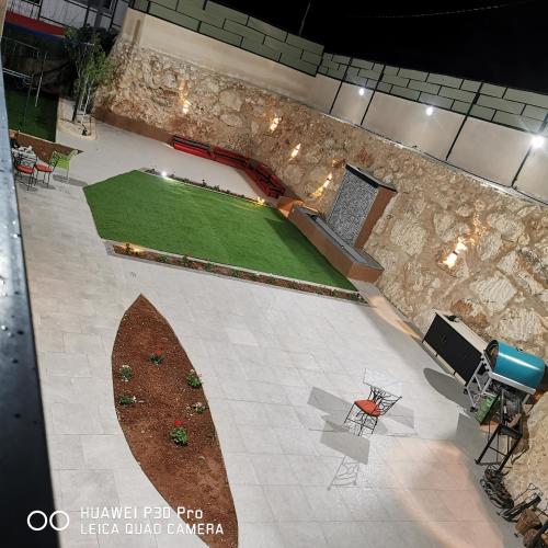 an overhead view of a golf course in a building at Musk of night chalet in Jerash