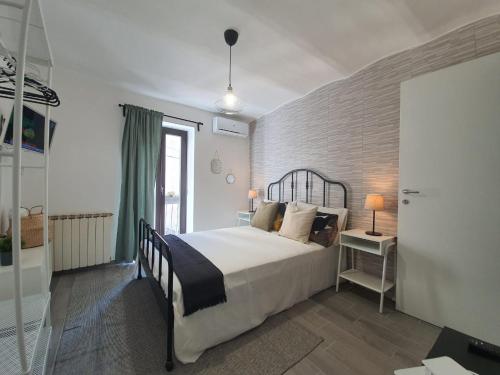 Postel nebo postele na pokoji v ubytování CASA DINA - Fondi Vertice Rooms