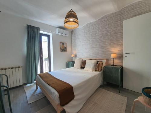 Letto o letti in una camera di CASA DINA - Fondi Vertice Rooms