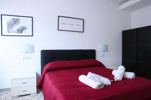 A bed or beds in a room at Attico vista mare