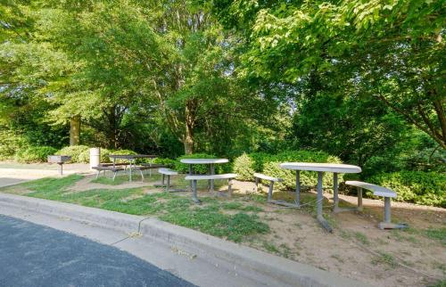a group of picnic tables and benches in a park at Extended Stay America Suites - Washington DC Germantown Milestone in Germantown