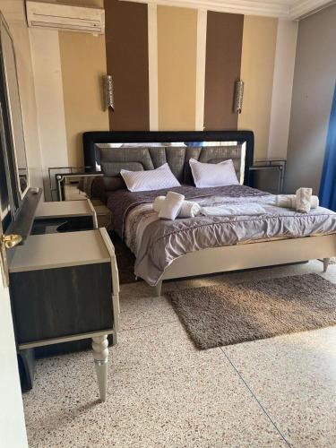 Ένα ή περισσότερα κρεβάτια σε δωμάτιο στο Grand appartement 3 chambre