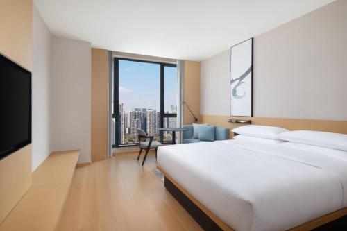 Postel nebo postele na pokoji v ubytování Fairfield by Marriott Chengdu Hi-Tech Zone