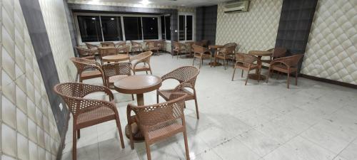 a row of tables and chairs in a room at Best Dreams Hotel in Cairo