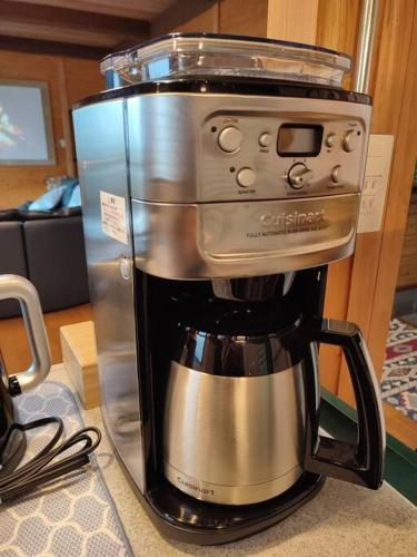 a coffee maker sitting on top of a counter at The Gold Beach House in Daisen