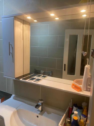 a bathroom with a sink and a mirror at Renton Residence in Renton