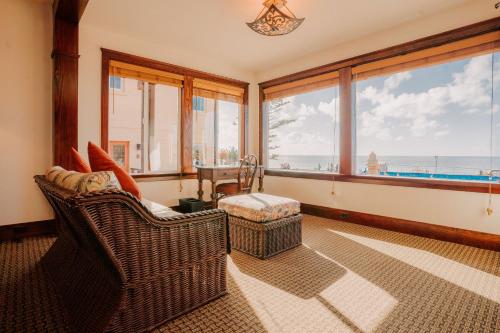 a living room with a view of the ocean at Pantai Inn in San Diego