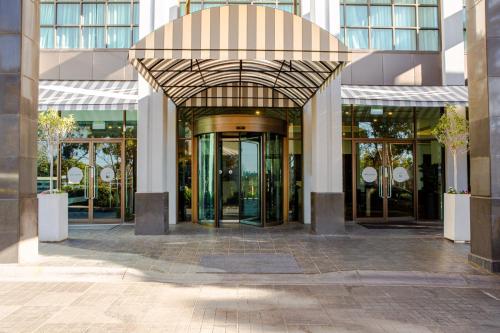 an entrance to a building with revolving doors at Novotel Melbourne Glen Waverley in Glen Waverley