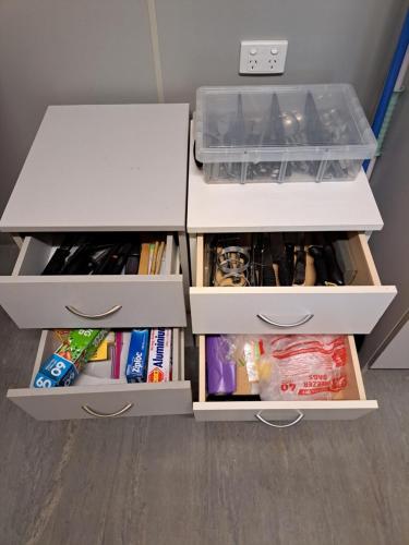 a room with two white drawers and a drawerploadploadploadpload at Cooktown Fishing Haven in Cooktown