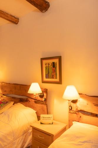 Ένα ή περισσότερα κρεβάτια σε δωμάτιο στο Almawasi Lodge