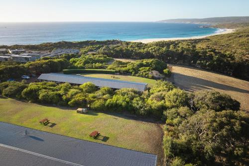 an aerial view of a farm with the ocean at Chandlers Smiths Beach Villas in Yallingup