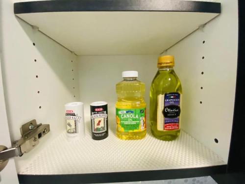 three bottles of mustard and other condiments in a refrigerator at Quinta Real 4909 in McAllen