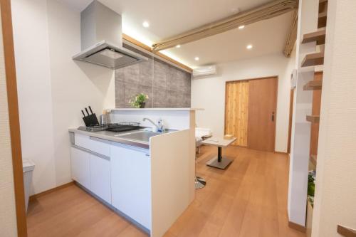 a kitchen with a sink and a counter top at 和居 東桜 静かで落ち着く 大阪城近くの好立地物件 in Osaka