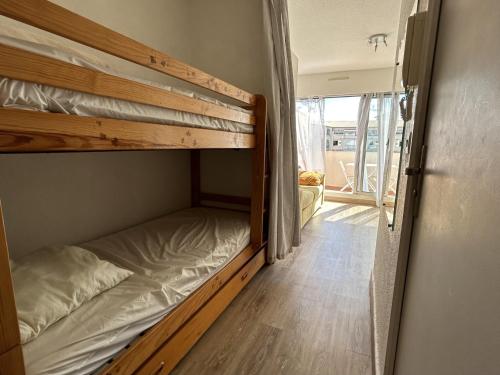 a couple of bunk beds in a room at Studio cabine à Sète avec terrasse et climatisation - FR-1-338-106 in Sète