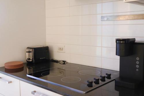 a kitchen with a counter top with a coffee maker at Downtown Dream in Toronto
