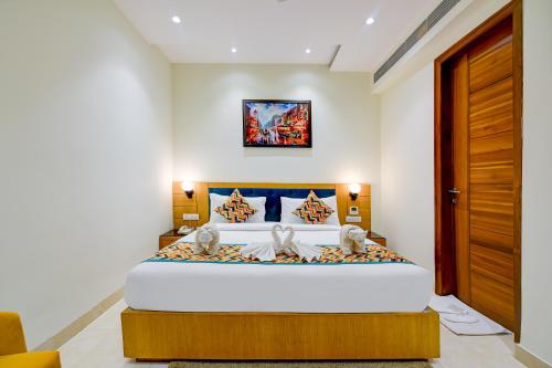 a bedroom with a large bed in a room at Classio Royale By iO Hotels Near Golden Temple in Amritsar