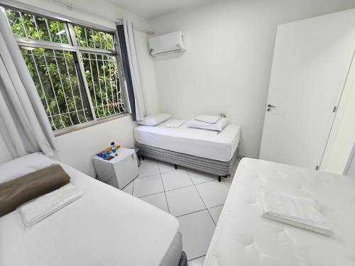 Ένα ή περισσότερα κρεβάτια σε δωμάτιο στο Quarto Privativo em Condominio