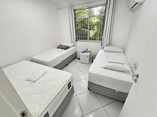 Ένα ή περισσότερα κρεβάτια σε δωμάτιο στο Quarto Privativo em Condominio