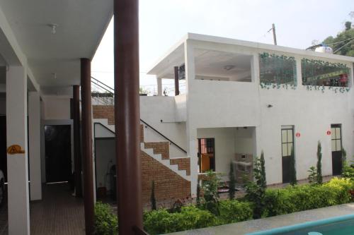 a view of a house with a staircase at El Rincón Preferido in Papantla de Olarte