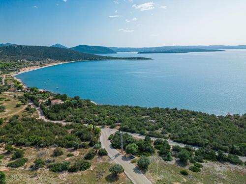 an aerial view of a beach and the ocean at Costa Bianca Villas in Koilás