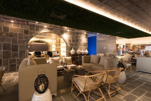 a store with chairs and couches in a room at Hotel Casa Hintze Ribeiro in Ponta Delgada