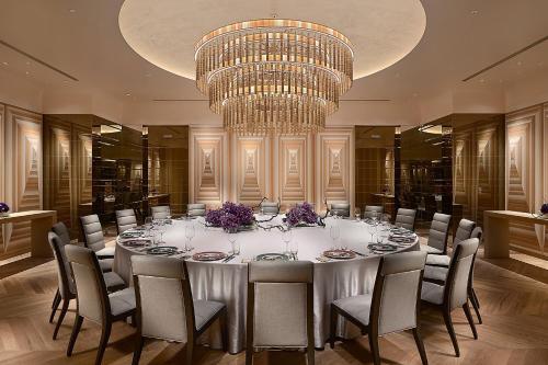 a large table in a room with a chandelier at Taipei Marriott Hotel in Taipei