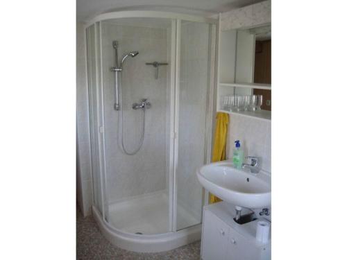 a bathroom with a shower and a sink at Anne Leipert Modern retreat in Seifhennersdorf