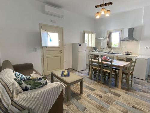 a living room with a couch and a table at Evdokia's House Amorgos-Chora in Amorgos