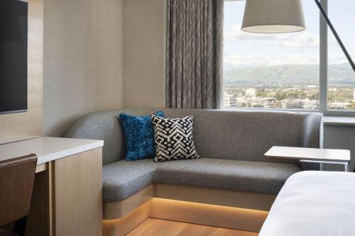a living room with a couch and a window at San Jose Marriott in San Jose