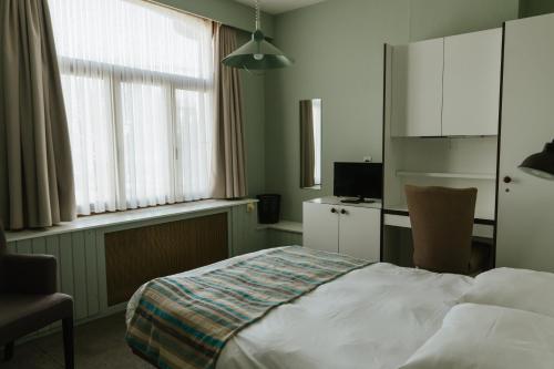 Postel nebo postele na pokoji v ubytování Hotel Kempenrust