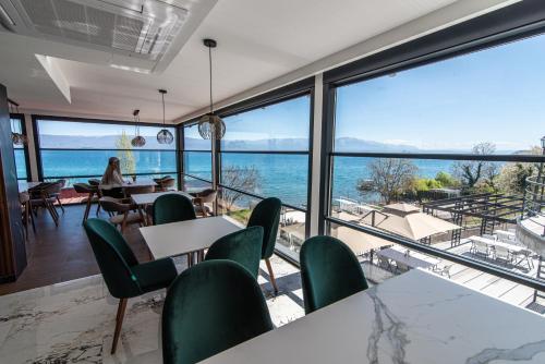 a restaurant with a view of the ocean at Dishli Hotel & Spa in Struga