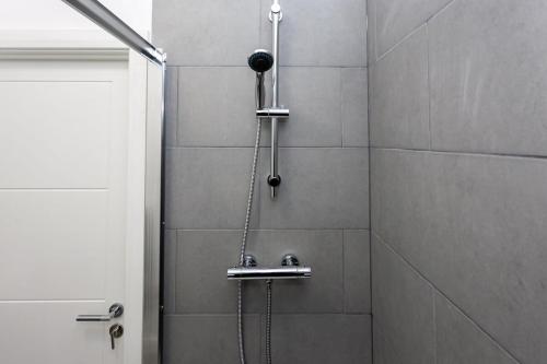 a shower with a shower head in a bathroom at Fantastic 1 Bedroom Apartment in Bolton in Bolton