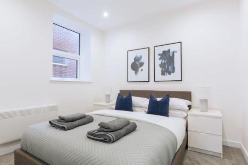 a bedroom with a bed with two pillows on it at Budget 1 Bedroom Apartment in Central Ipswich in Ipswich