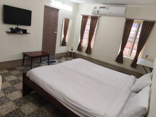 Postel nebo postele na pokoji v ubytování CM Residency