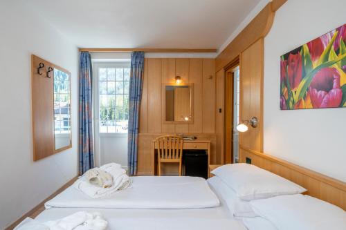 Ein Bett oder Betten in einem Zimmer der Unterkunft MyTime Hotels Savoy