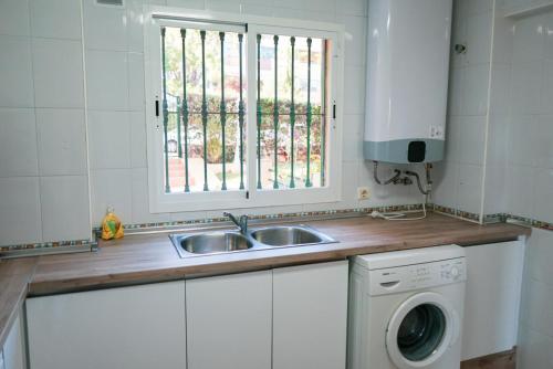 a kitchen with a sink and a window at Casa Lince: 2/2 in Marbella in Marbella