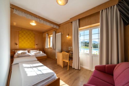 A bed or beds in a room at MyTime Hotels Savoy