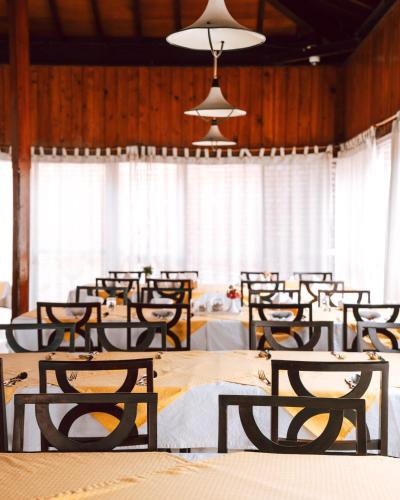 a group of tables and chairs in a room at Hokke Lumbini in Lumbini