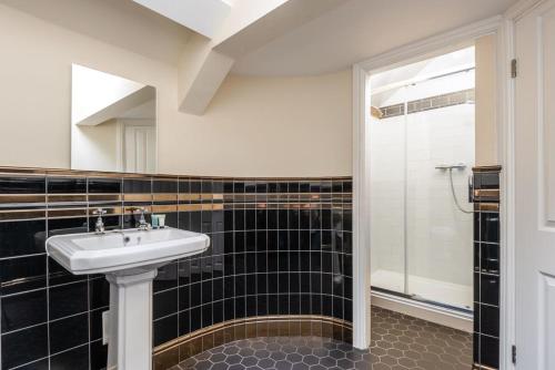 a bathroom with a sink and a shower at Budget Studio Apartment in Central Doncaster in Doncaster