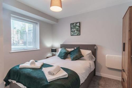 a bedroom with a bed with towels on it at Fantastic 1 Bedroom Apartment in Liverpool in Liverpool