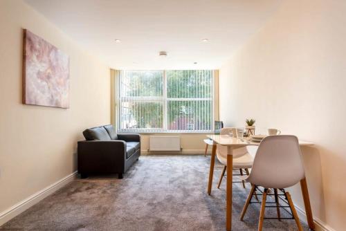 a living room with a couch and a table at Bright 1 Bedroom Budget Flat in Central Pontefract in Pontefract