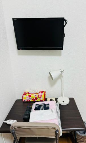 Postel nebo postele na pokoji v ubytování Ryokan Iwasawasou
