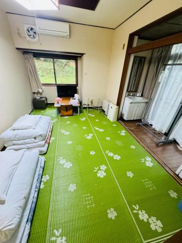 Postel nebo postele na pokoji v ubytování Ryokan Iwasawasou